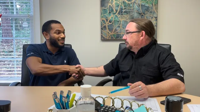 A seller at their closing with Hendrix Ventures Group